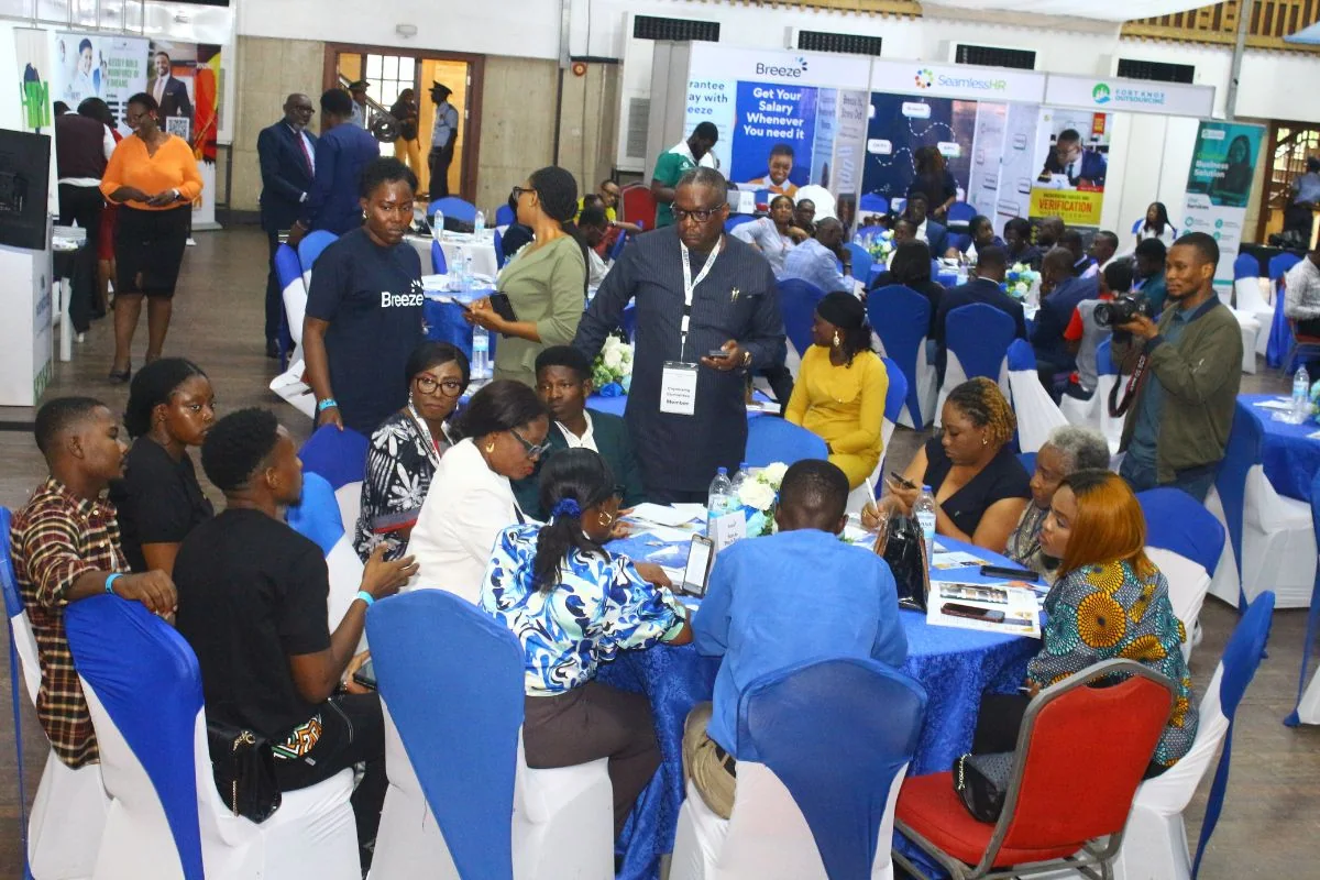 Expo attendees networking around exhibition tables
