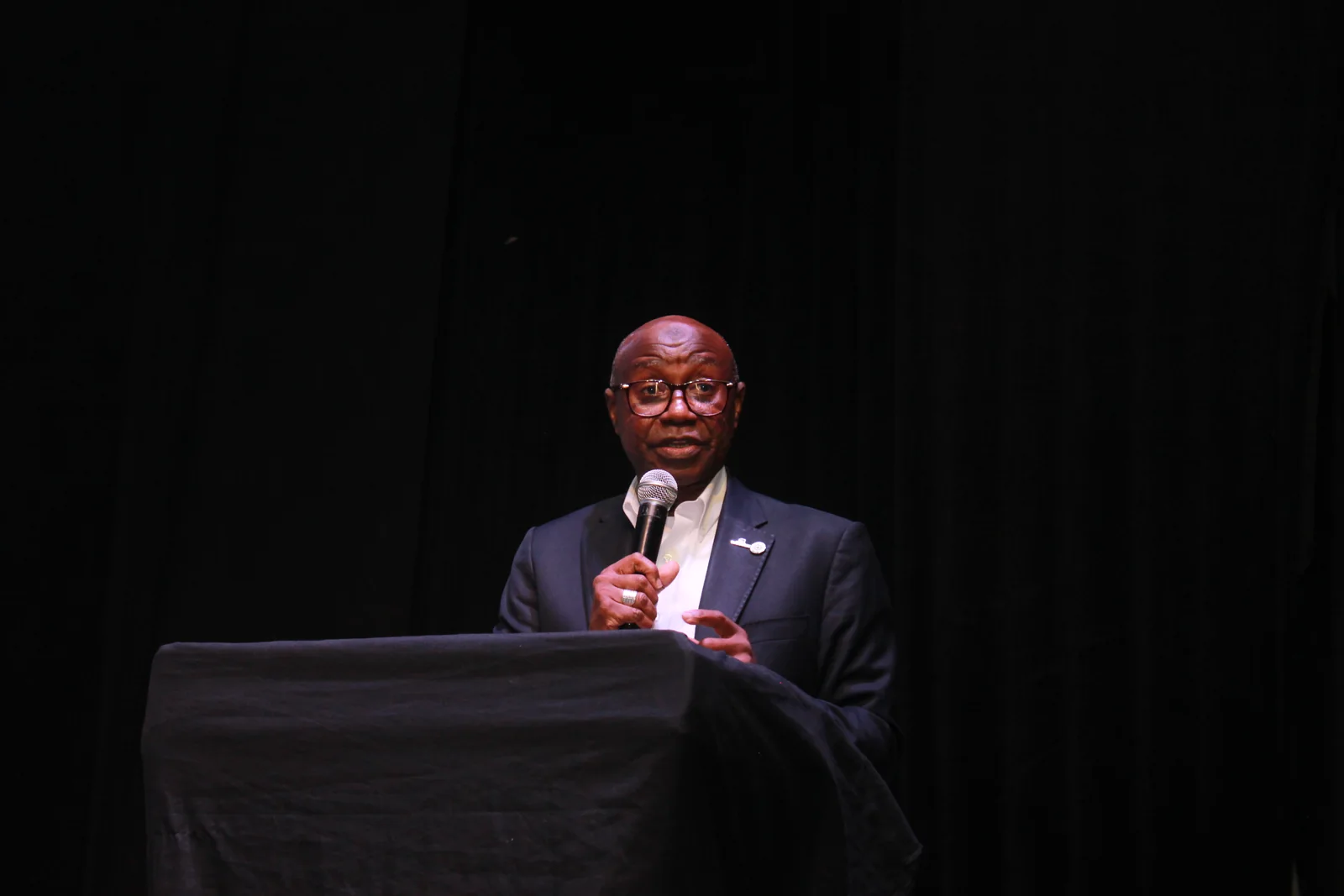 Keynote speaker addressing Outsourcing Expo 2026 from the lectern