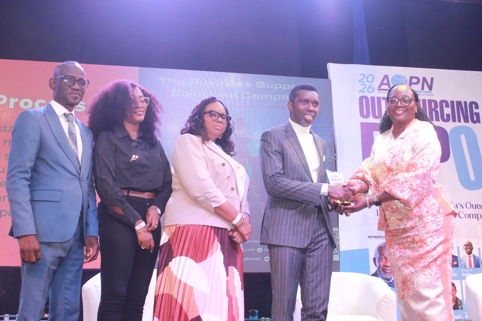 Award presentation handshake at Outsourcing Expo 2026